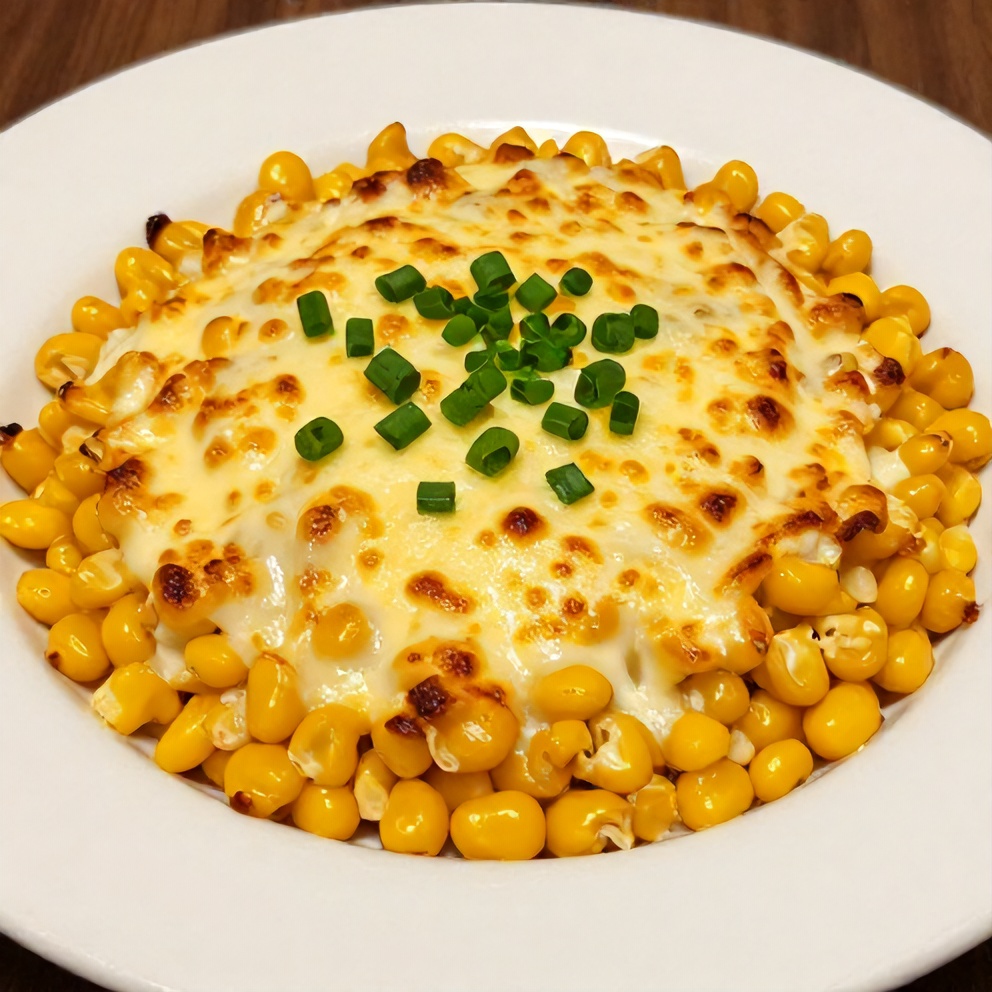One perfect plated serving of creamy jalapeño popper corn casserole on a white plate, garnished with chopped green onions, warm side lighting showing bubbly cheese and crispy edges