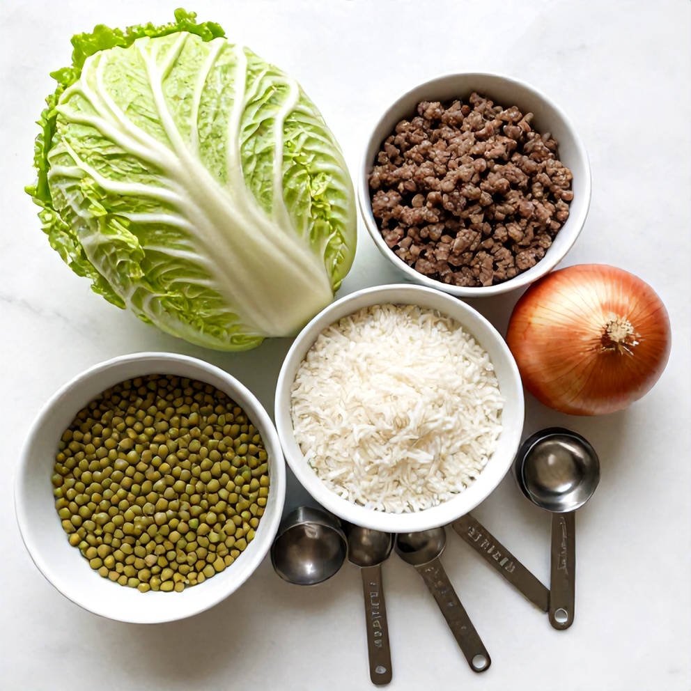 Raw ingredients for lentil and rice stuffed cabbage rolls on a white marble surface