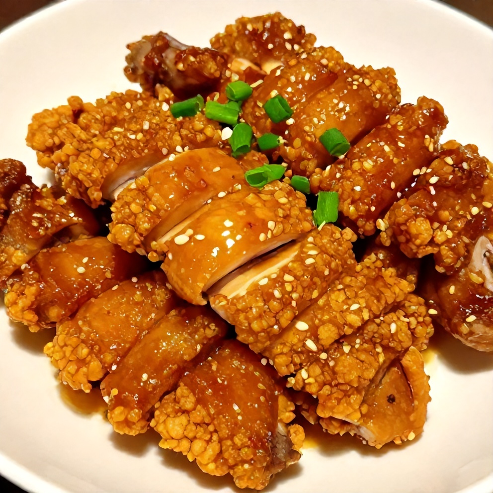 Plated sticky char siu chicken with green onions