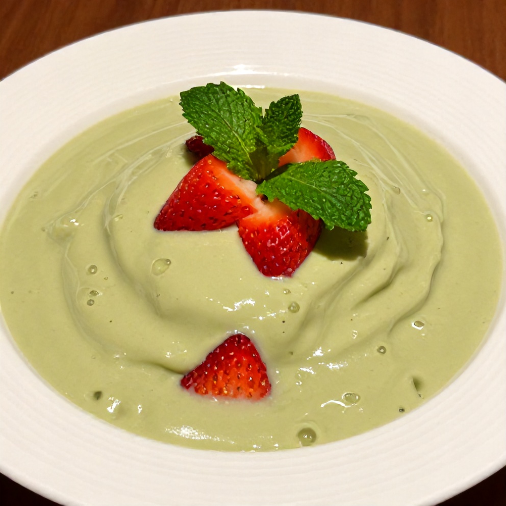 Plated Refreshing Strawberry Matcha Sago Dessert with a mint leaf garnish